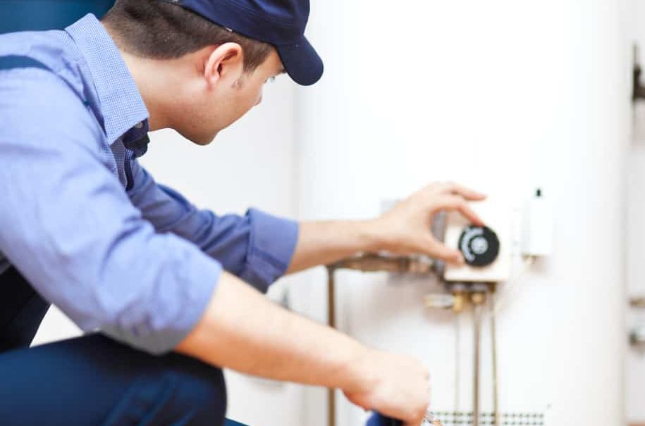 plumber installing water heater